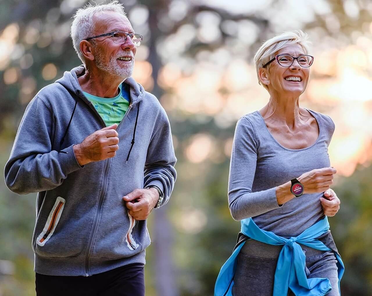 Couple running with one wearing MGMove
