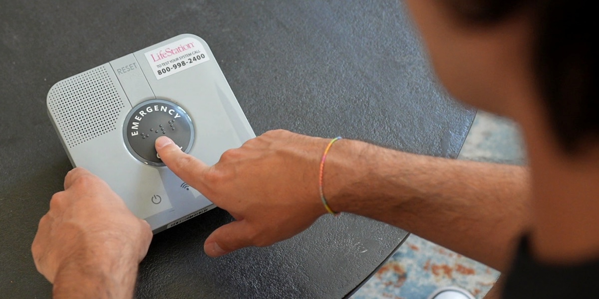 Pressing emergency call button on LifeStation Sidekick Home