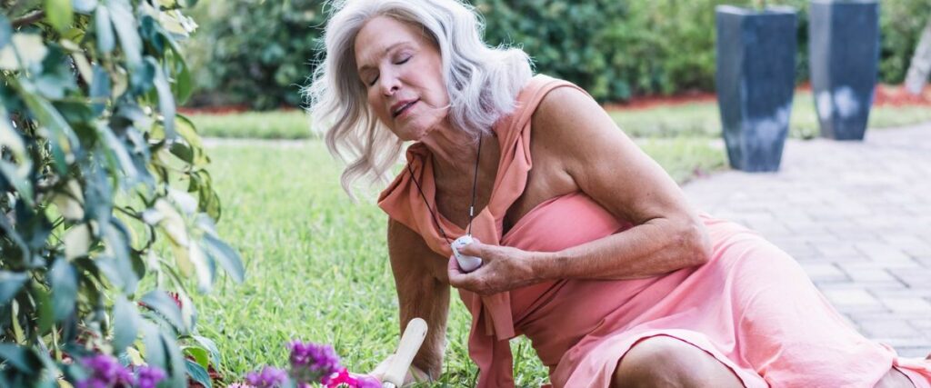 Elderly woman using MobileHelp device