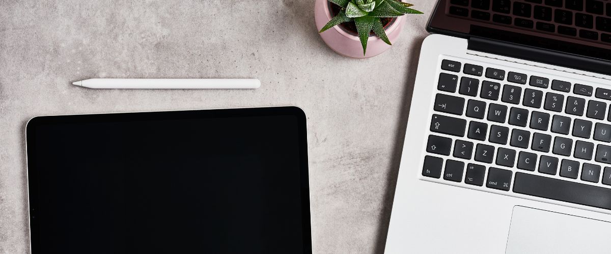 Tablet with pencil and laptop