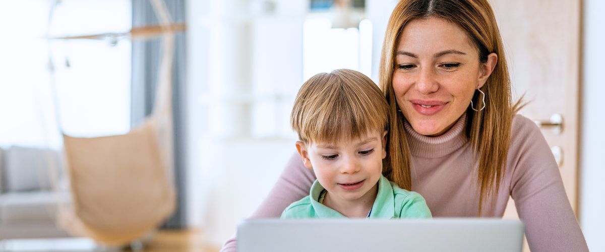Mother with kid on laptop