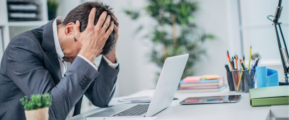 Worried person with hands on head