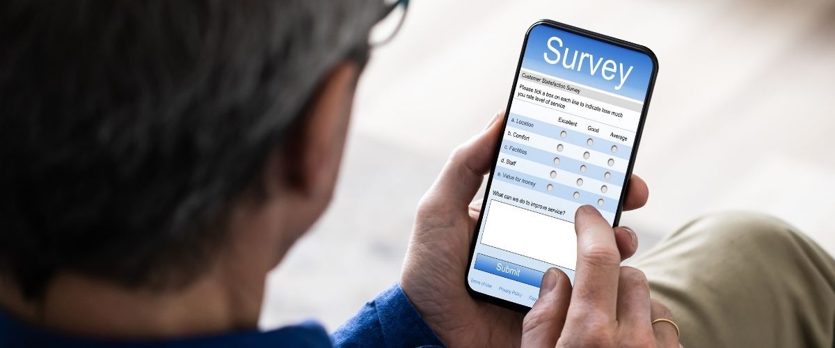 Person with smartphone answering a survey