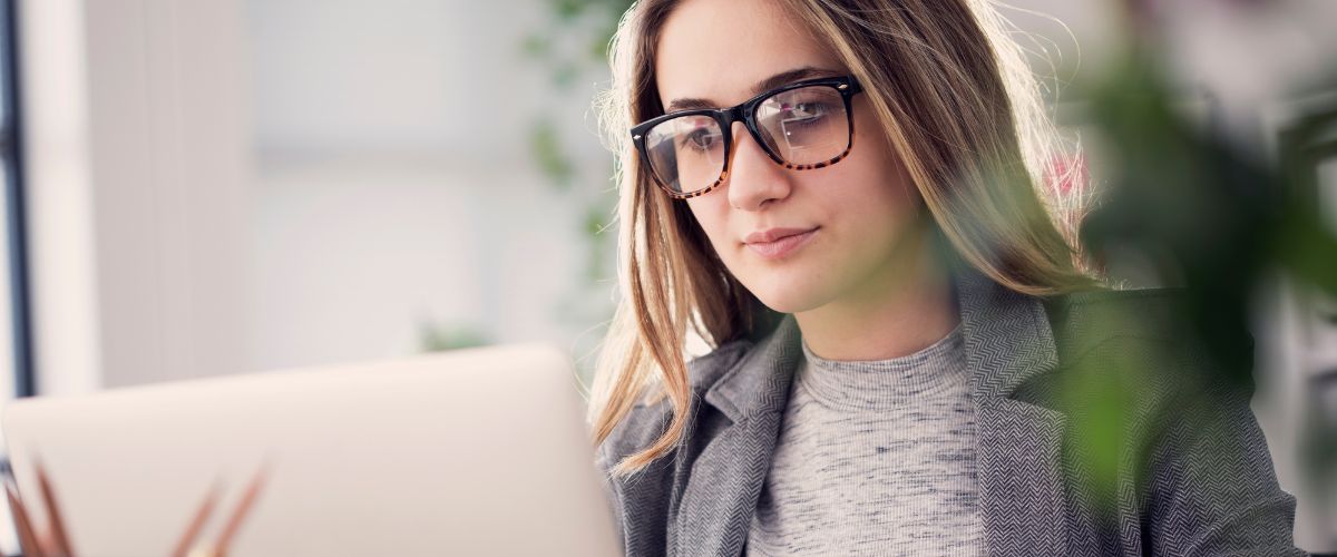 Woman focused on laptop