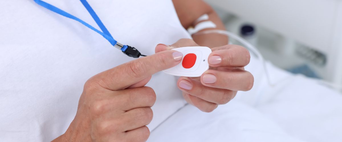 Woman pressing medical alert button