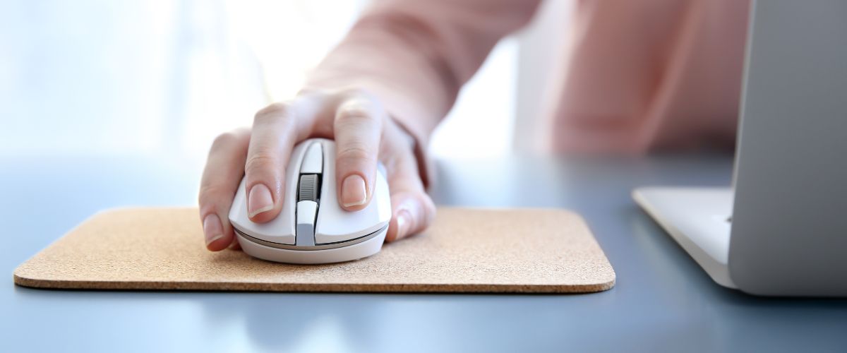 Woman using laptop mouse